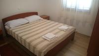 a bedroom with a bed with two towels on it at Apartment Seline 11197b in Starigrad