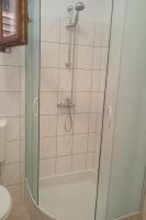 a shower with a glass door in a bathroom at Apartment Seline 11197b in Starigrad