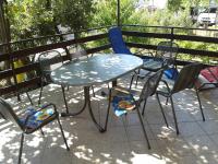 a table and chairs sitting on a balcony at Apartments with a parking space Betina, Murter - 11322 in Betina