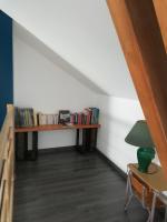 a room with two wooden shelves with books at La Ruelle : chambres d&#39;hôtes in Saumur