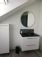 a bathroom with a sink and a mirror at La Ruelle : chambres d&#39;hôtes in Saumur