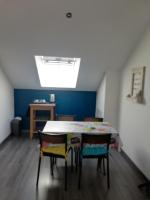 a room with a table and chairs and a skylight at La Ruelle : chambres d&#39;hôtes in Saumur