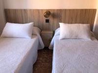 Posteľ alebo postele v izbe v ubytovaní APARTAMENTO KORINTO
