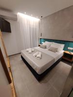 Posteľ alebo postele v izbe v ubytovaní Pleasant Stay