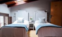 Posteľ alebo postele v izbe v ubytovaní Hotel Rural Princesa Kristina