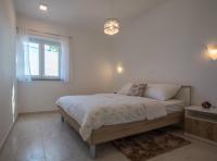 Posteľ alebo postele v izbe v ubytovaní Family friendly apartments with a swimming pool Verunic, Dugi otok - 14286