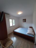 Posteľ alebo postele v izbe v ubytovaní Apartments by the sea Slatine, Ciovo - 16343