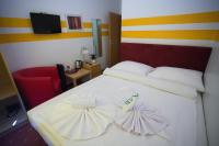 Posteľ alebo postele v izbe v ubytovaní Hotel City Residence