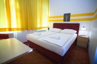 Posteľ alebo postele v izbe v ubytovaní Hotel City Residence