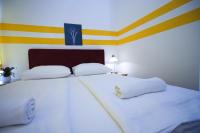 Posteľ alebo postele v izbe v ubytovaní Hotel City Residence