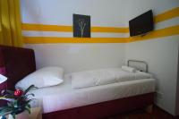 Posteľ alebo postele v izbe v ubytovaní Hotel City Residence
