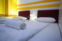 Posteľ alebo postele v izbe v ubytovaní Hotel City Residence