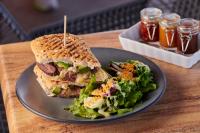 a sandwich and salad on a plate on a table at Ibis Torreon in Torreón