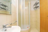 a bathroom with a sink and a shower at Apartment Okrug Donji 16657b in Okrug Donji