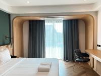Postel nebo postele na pokoji v ubytování Sann Boutique Hotel