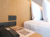 Postel nebo postele na pokoji v ubytování Sann Boutique Hotel