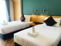 Postel nebo postele na pokoji v ubytování Sann Boutique Hotel