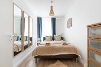 A bed or beds in a room at Budapest Holidays Apartments Family