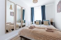 A bed or beds in a room at Budapest Holidays Apartments Family