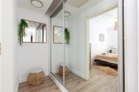 A bed or beds in a room at Budapest Holidays Apartments Family
