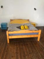 Łóżko lub łóżka w pokoju w obiekcie Maison spacieuse authentique proche St Malo Rennes, bienvenue à la Casa Cozumel