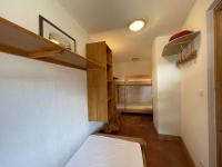 Łóżko lub łóżka w pokoju w obiekcie Appartement cosy avec piscine à 300m du lac de baignade, proche du village et des pistes - Praz-sur-Arly - FR-1-603-62
