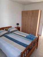 Łóżko lub łóżka w pokoju w obiekcie Appartement avec extérieur et parking gratuit