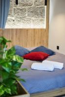 Posteľ alebo postele v izbe v ubytovaní Apartament "Powoli" z darmowym parkingiem