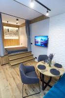 Televízia a/alebo spoločenská miestnosť v ubytovaní Apartament "Powoli" z darmowym parkingiem
