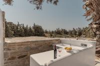 Nápoje v ubytovaní Ammolofos Luxury Apartment & suites