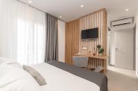 Posteľ alebo postele v izbe v ubytovaní Ammolofos Luxury Apartment & suites