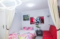 A bed or beds in a room at Camp Nou, Europa Fira - modern two-bedroom apartment with heating