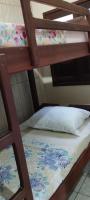 a couple of bunk beds with a pillow on them at Pousada Exuberante in Abraão