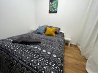 Łóżko lub łóżka w pokoju w obiekcie Mon Palmier Grand Appartement Parking Un-Séjour-à-Part