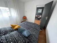 Łóżko lub łóżka w pokoju w obiekcie Mon Palmier Grand Appartement Parking Un-Séjour-à-Part