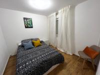 Łóżko lub łóżka w pokoju w obiekcie Mon Palmier Grand Appartement Parking Un-Séjour-à-Part