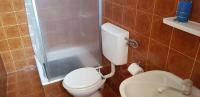 a bathroom with a toilet and a shower at Apartments by the sea Pisak, Omis - 1018 in Pisak