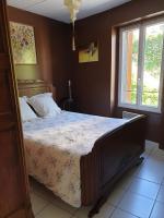 Una cama o camas en una habitaci&oacute;n de Maison au pied du parc national des C&eacute;vennes