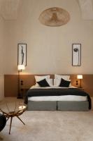 Posteľ alebo postele v izbe v ubytovaní Palazzo Tafuri Boutique Hotel