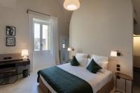 Posteľ alebo postele v izbe v ubytovaní Palazzo Tafuri Boutique Hotel