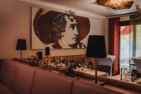 a dining room with a table with a crown on the wall at Das Schokoladenhotel in Westerstede