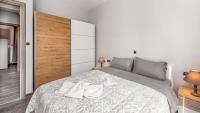 A bed or beds in a room at East Coast Apartment Ilios Rhodes