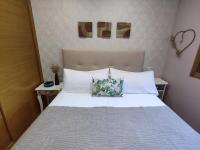 A bed or beds in a room at La Dorada