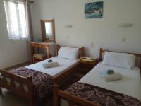 Postel nebo postele na pokoji v ubytování Villa Kaloudis Rooms