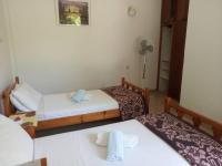 Postel nebo postele na pokoji v ubytování Villa Kaloudis Rooms