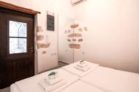 Posteľ alebo postele v izbe v ubytovaní Marthas DeLight Rooms