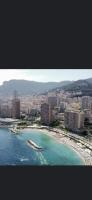 an aerial view of a beach with buildings and the ocean at Une terrasse sur Monaco logement 2 chambre in Beausoleil