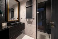 a bathroom with a sink and a shower with a mirror at Superior, classy residence,7&#47;24 Security,2 bedroom ( Benesta 205 ) in Istanbul