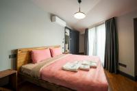 a bedroom with a large bed with two towels on it at Superior, classy residence,7&#47;24 Security,2 bedroom ( Benesta 205 ) in Istanbul