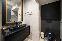 a bathroom with a black sink and a toilet at Superior, classy residence,7&#47;24 Security,2 bedroom ( Benesta 205 ) in Istanbul
